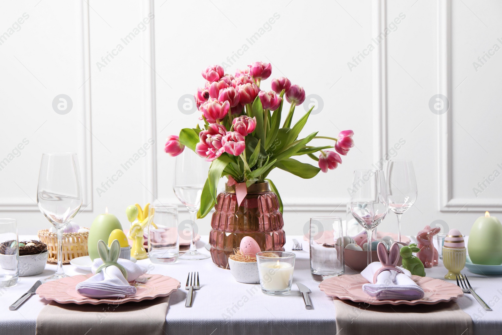 Photo of Festive table setting with beautiful flowers. Easter celebration