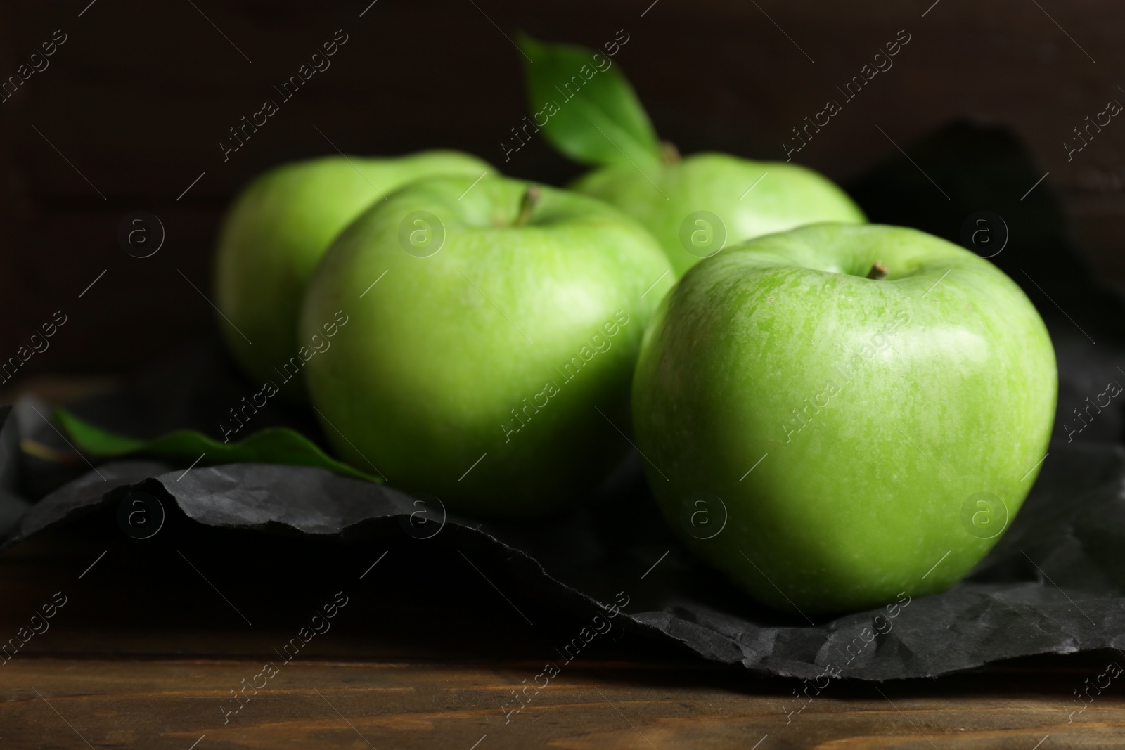 Photo of Fresh green apples on wooden table