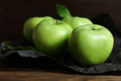 Photo of Fresh green apples on wooden table