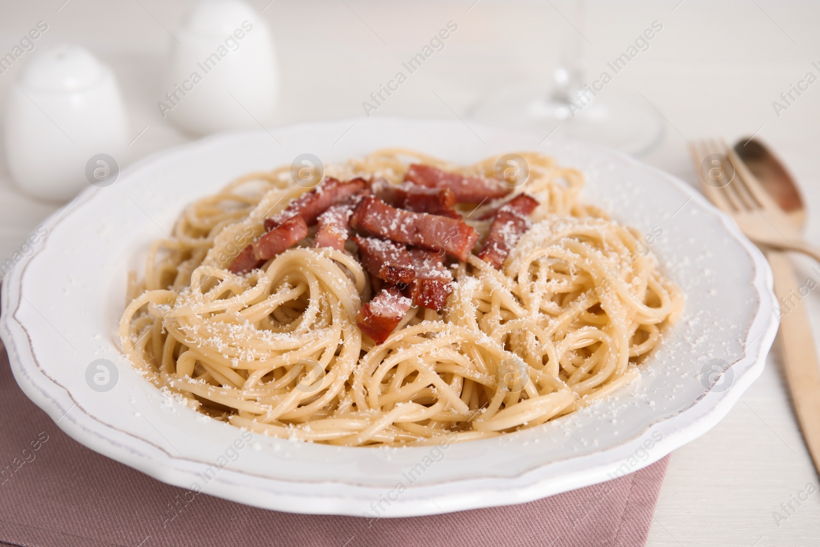 Photo of Delicious Carbonara pasta on white table, closeup