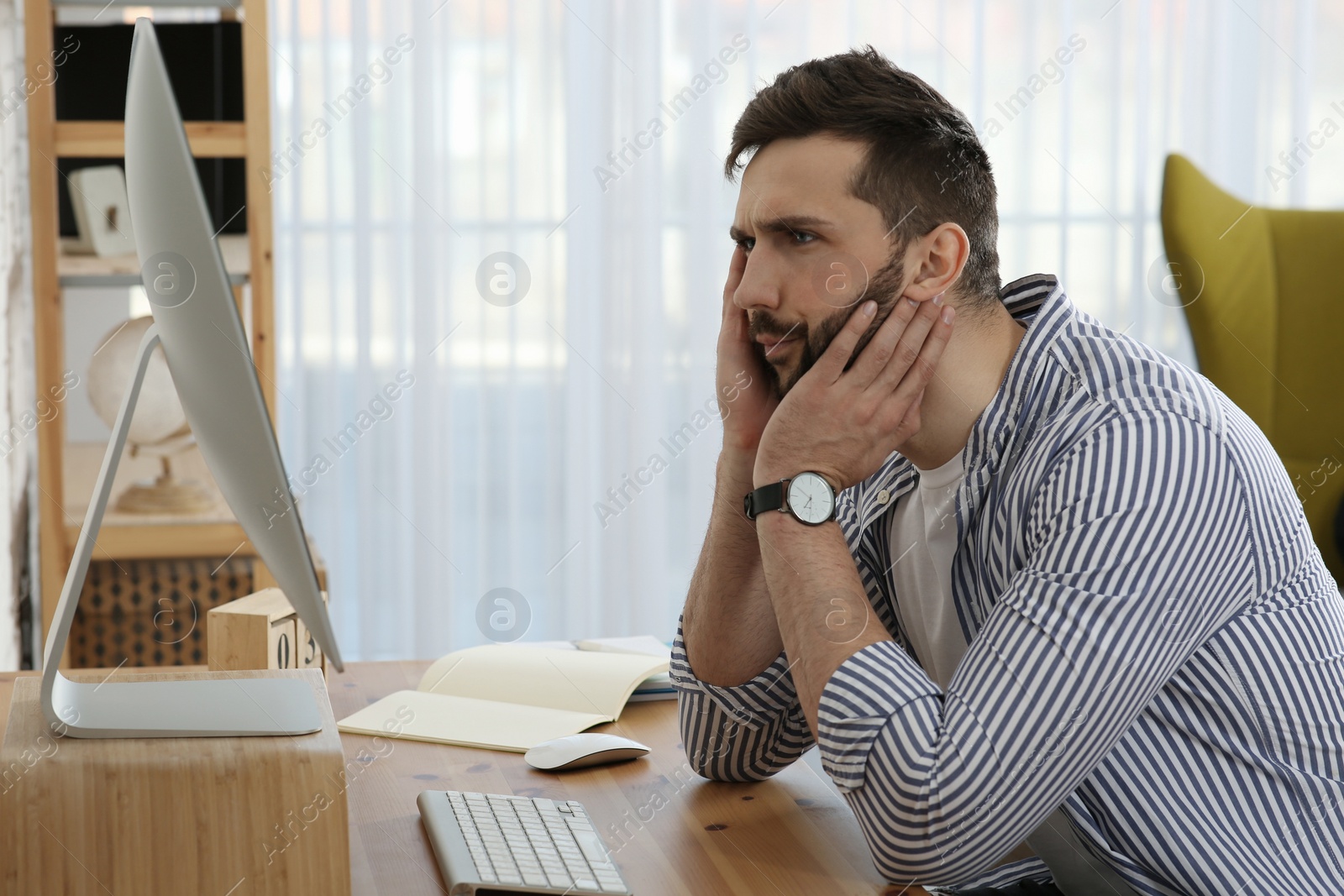 Photo of Online test. Man studying with computer at home