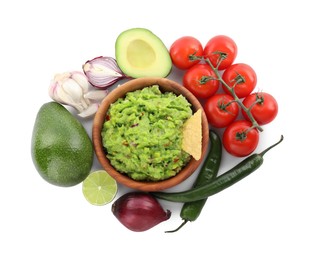 Photo of Delicious guacamole with nachos chips and ingredients isolated on white, top view