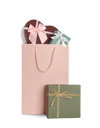 Photo of Paper shopping bag and gift boxes isolated on white