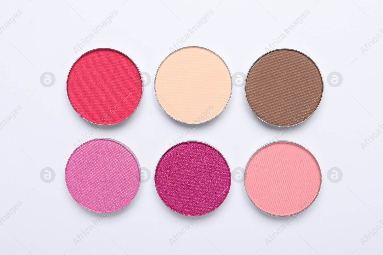 Photo of Beautiful eye shadow refill pans on white background, flat lay