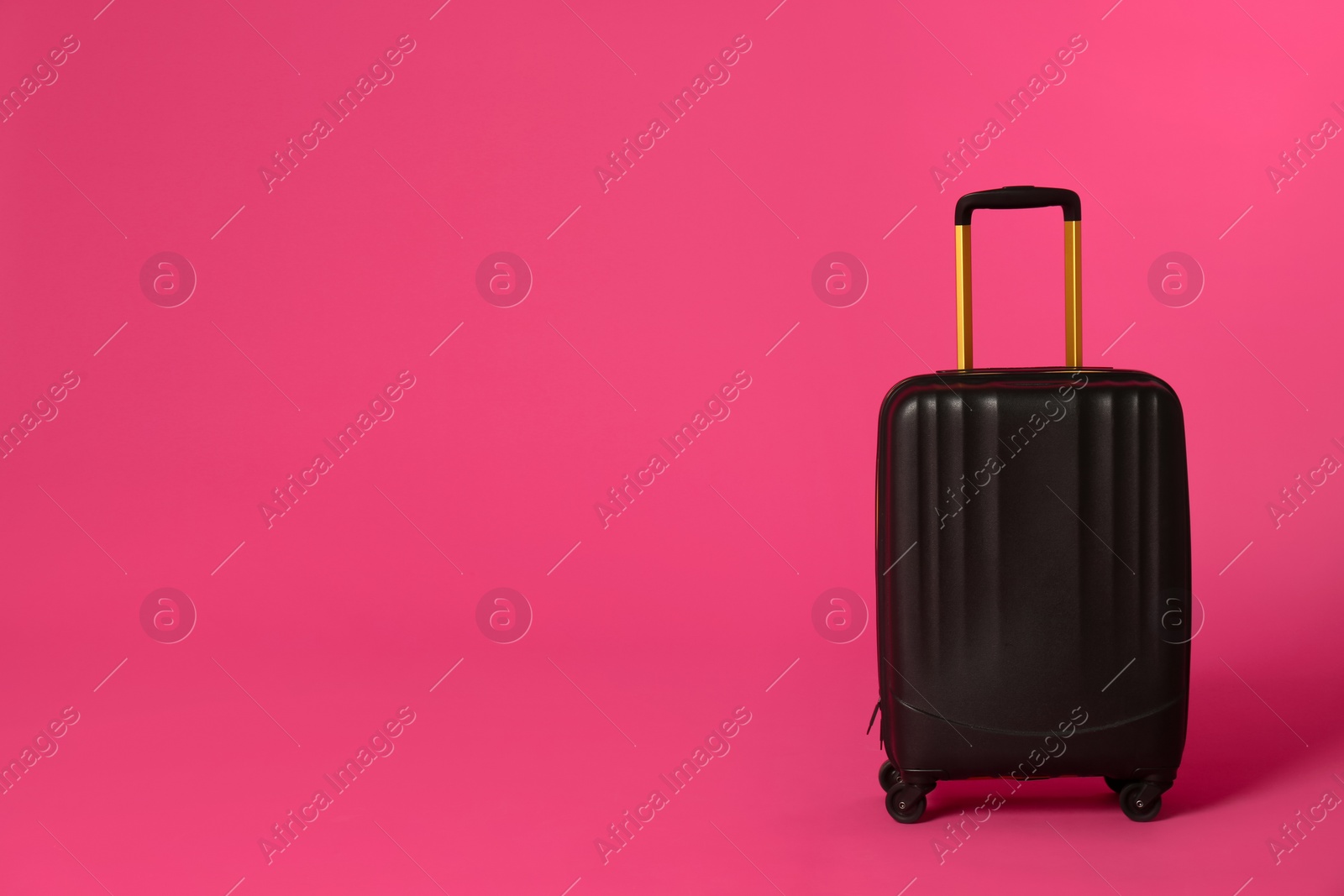 Photo of Stylish suitcase on color background. Space for text