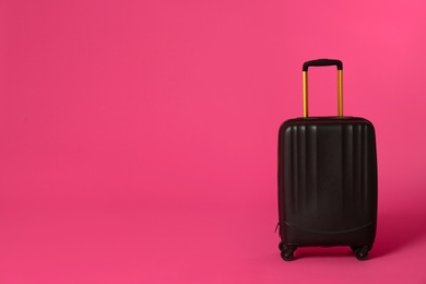 Photo of Stylish suitcase on color background. Space for text