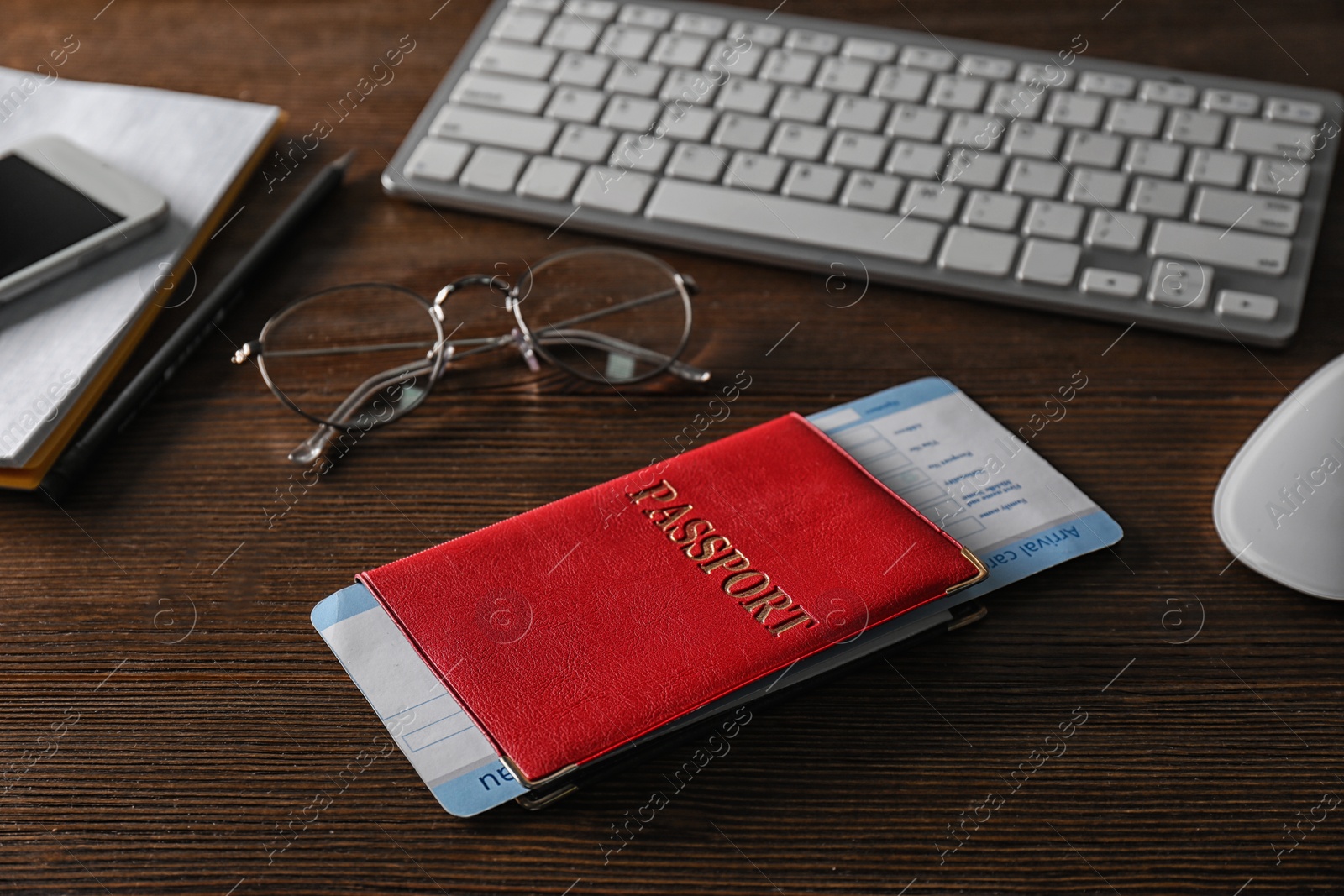 Photo of Composition with passport on wooden table. Travel agency concept