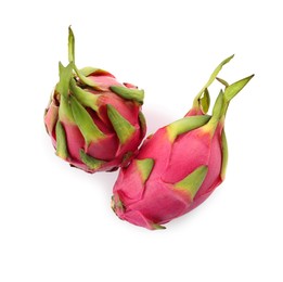 Photo of Delicious pink dragon fruits (pitahaya) on white background, top view
