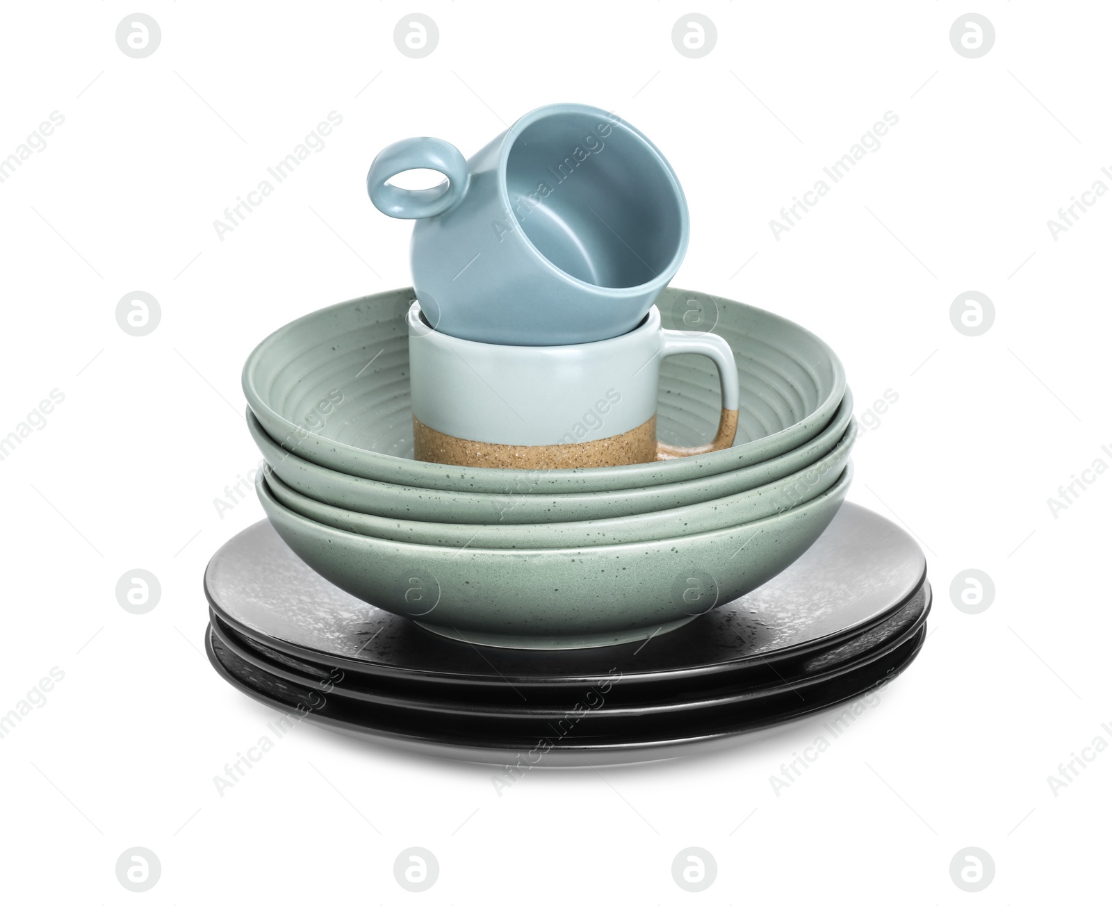 Photo of Beautiful ceramic plates, bowls and cups isolated on white