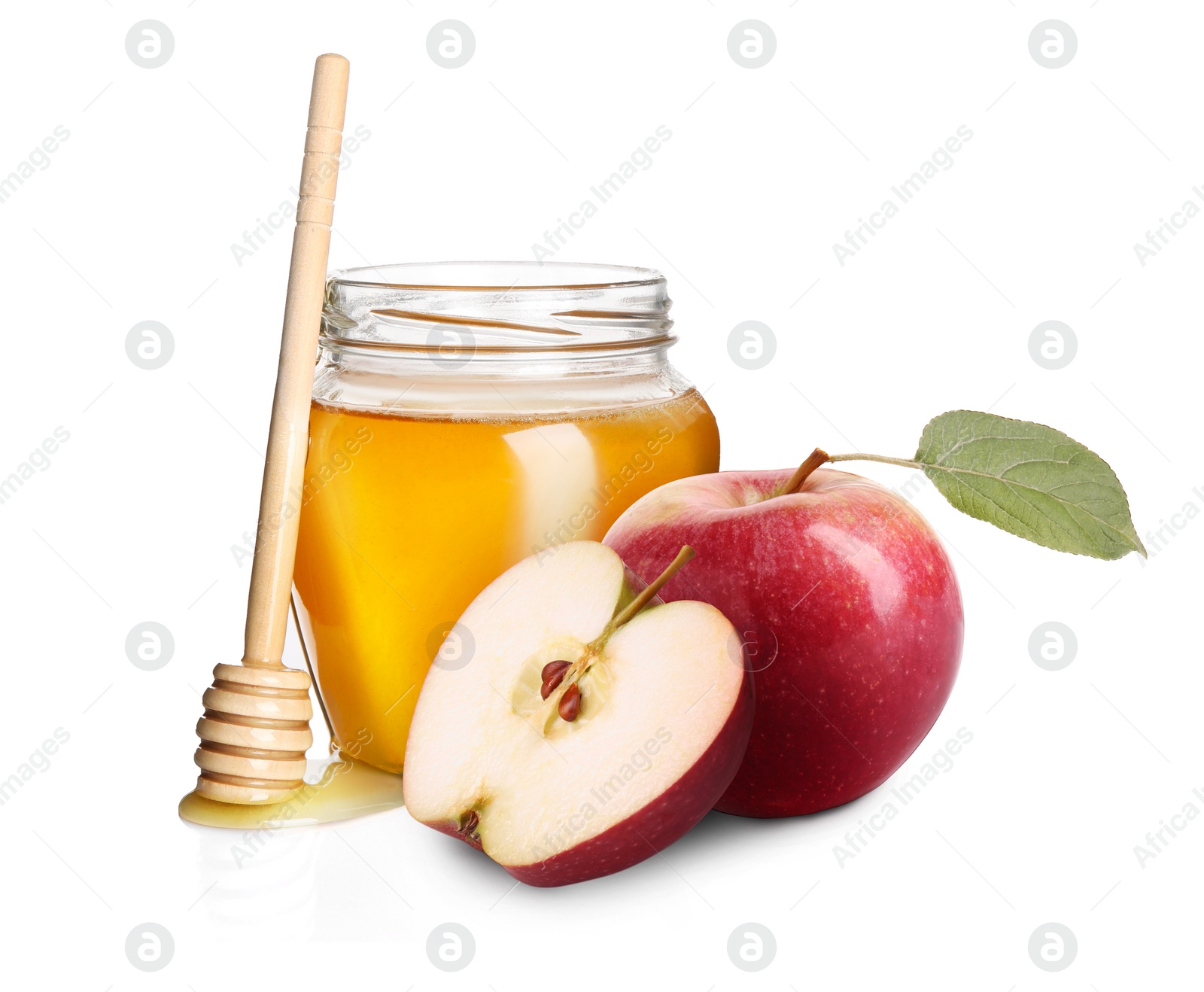 Image of Honey in glass jar, apples and dipper isolated on white