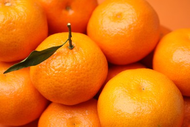 Photo of Heap of fresh juicy tangerines as background, closeup