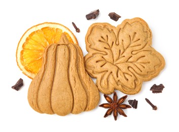 Different tasty cookies and spices on white background, top view