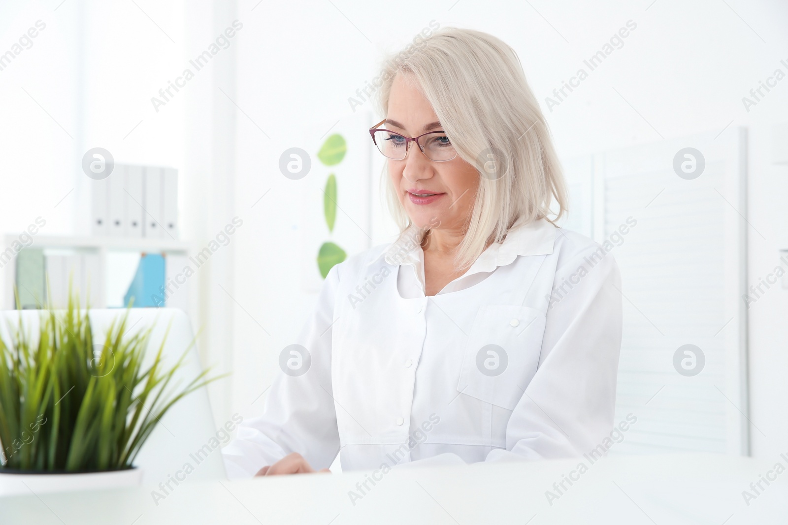 Photo of Senior female receptionist working in hospital