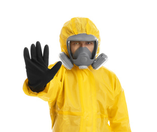 Man wearing chemical protective suit showing STOP gesture on white background. Prevention of virus spread