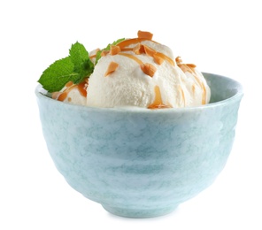 Photo of Delicious ice cream with caramel sauce, mint and nuts in bowl on white background
