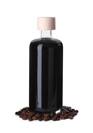 Bottle with coffee liqueur and beans isolated on white
