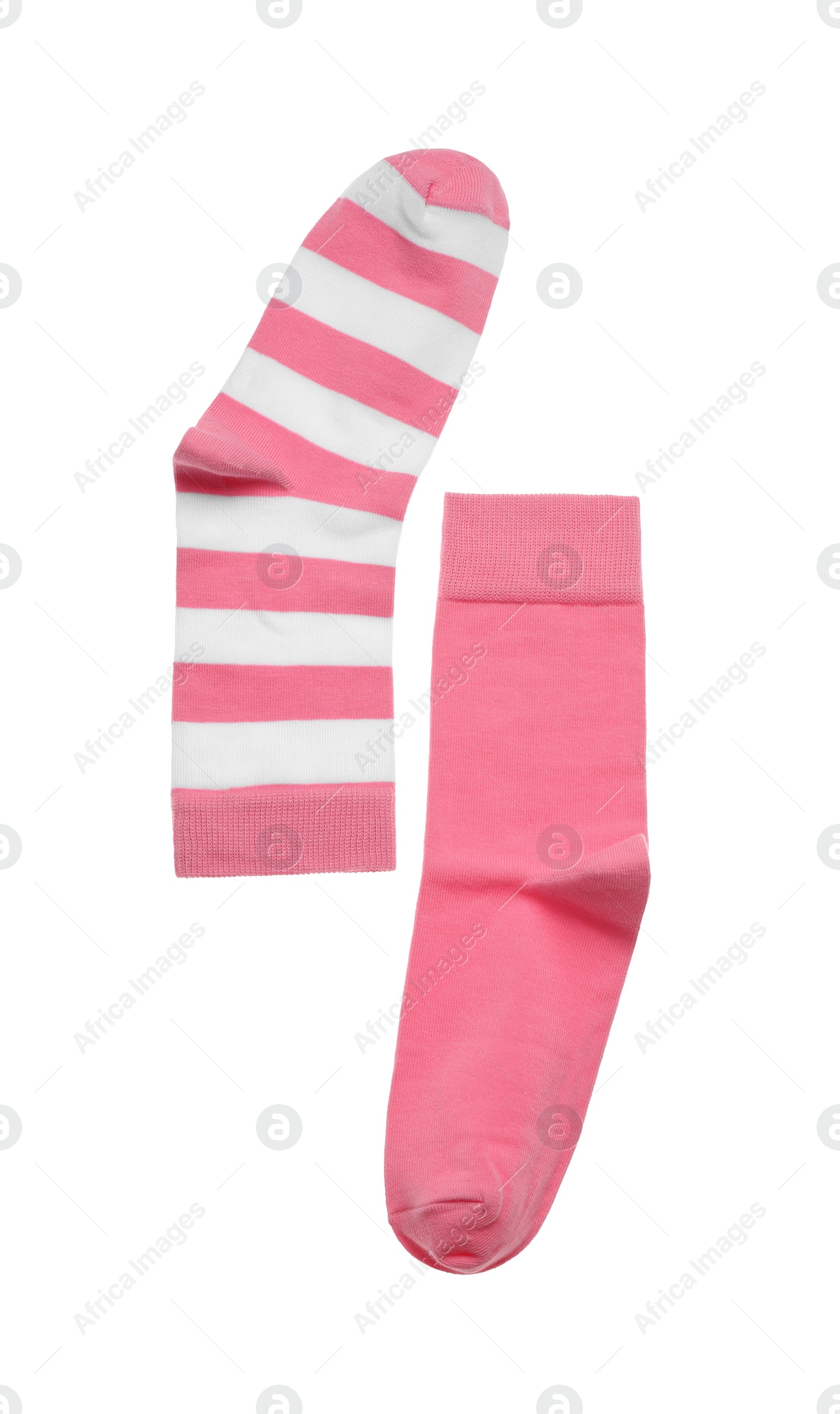 Photo of Different pink socks on white background, top view