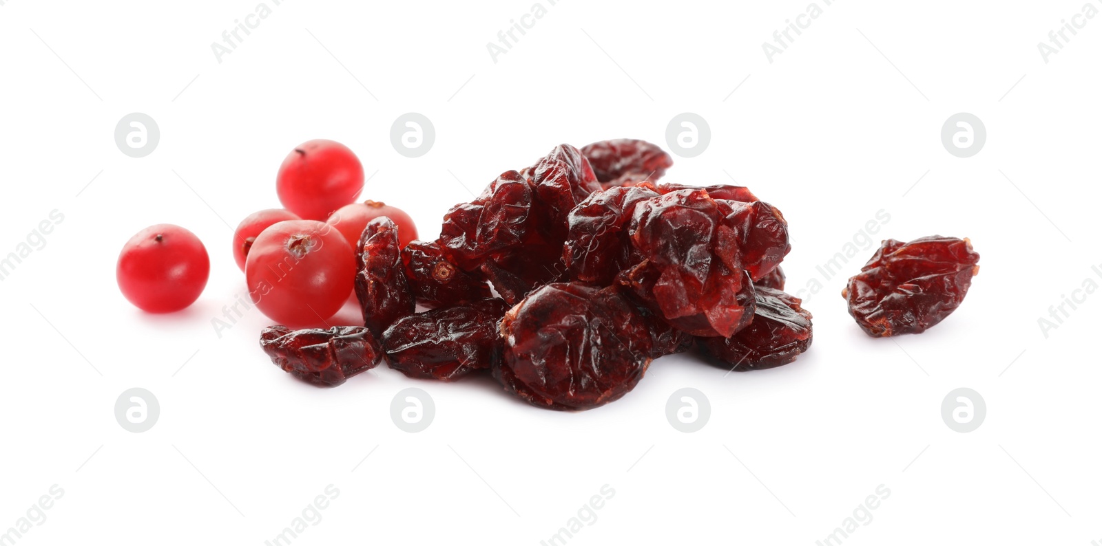 Photo of Tasty fresh and dried cranberries isolated on white