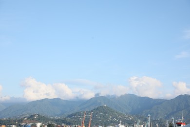 Picturesque view of modern city near mountains