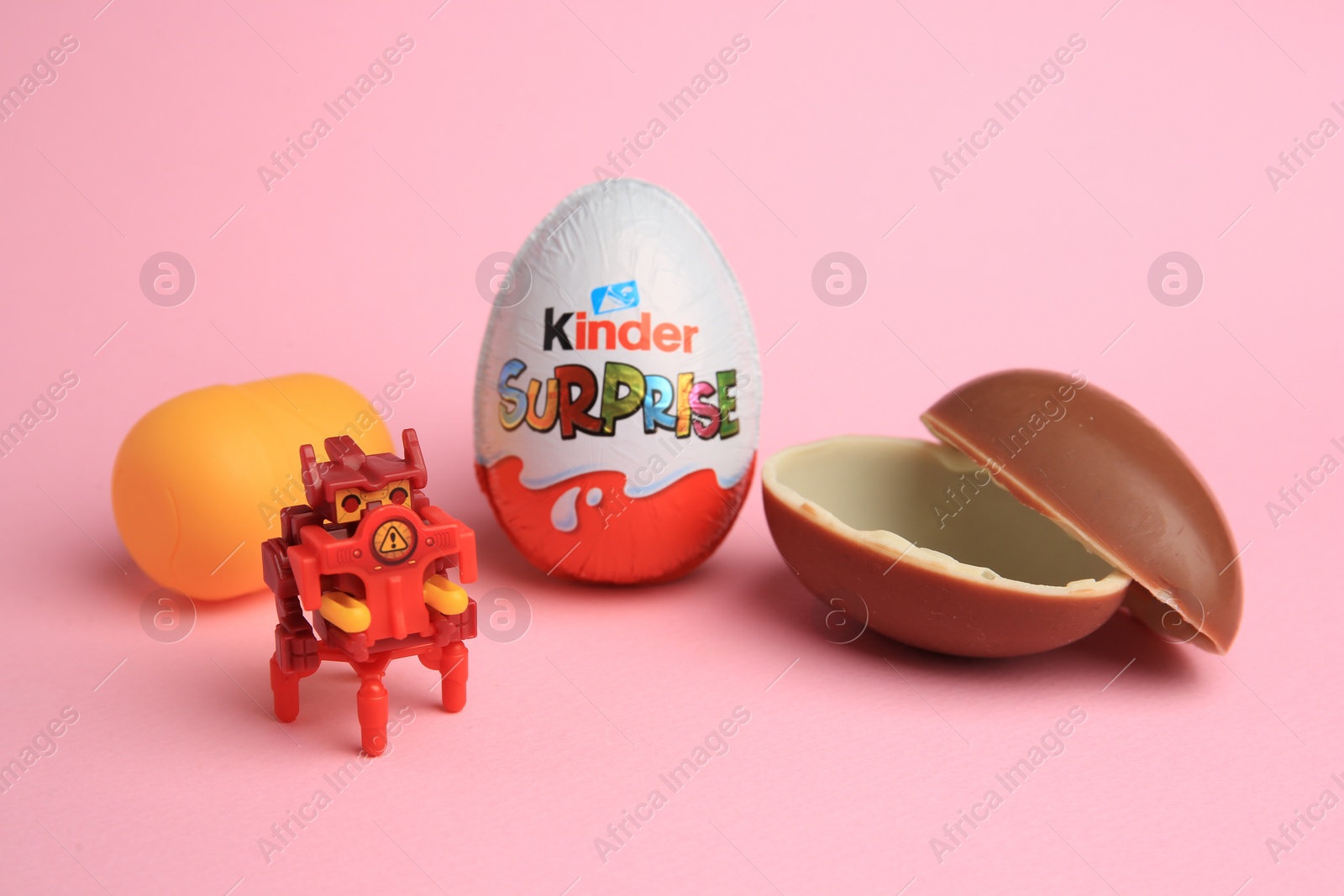 Photo of Sveti Vlas, Bulgaria - July 3, 2023: Kinder Surprise Eggs, plastic capsule and toy on pink background