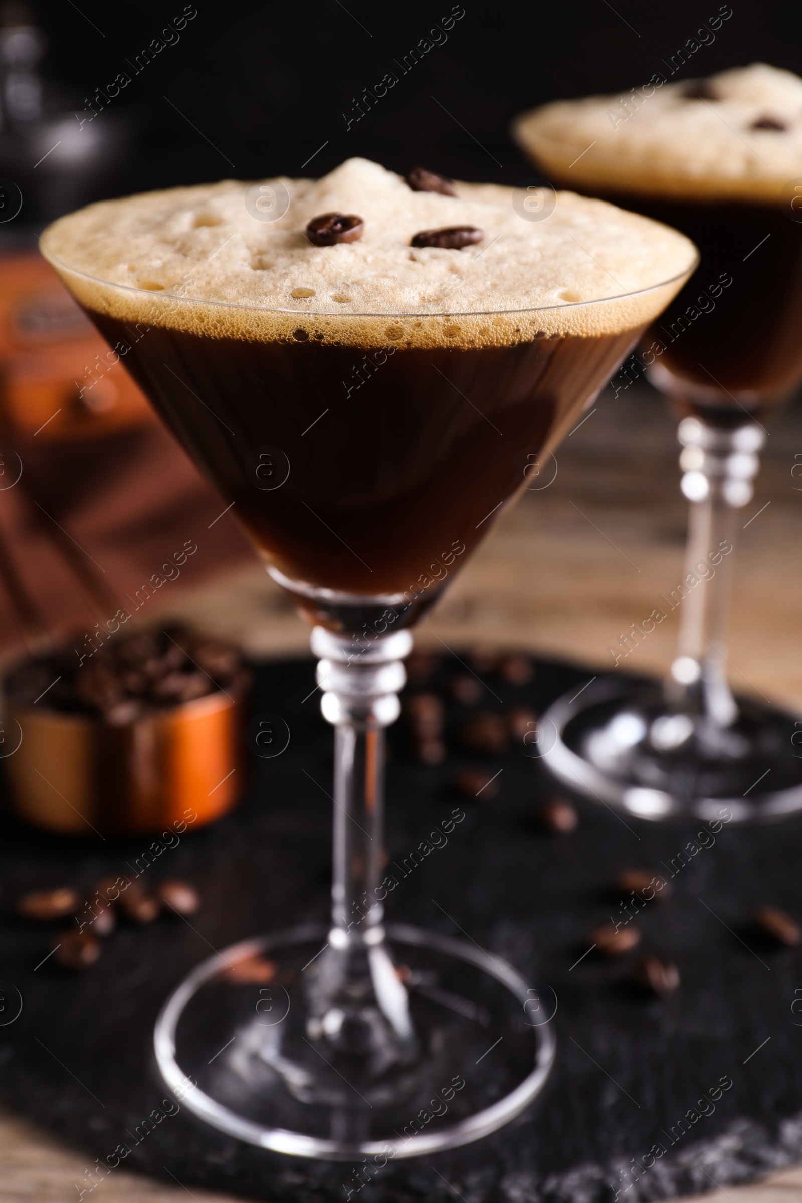 Photo of Glass of fresh cocktail with coffee beans, closeup