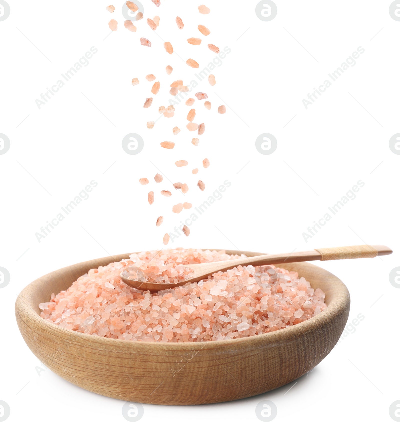 Image of Pink himalayan salt falling into bowl on white background