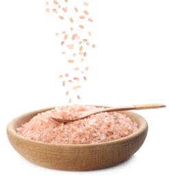 Image of Pink himalayan salt falling into bowl on white background