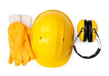 Photo of Hard hat, earmuffs and gloves isolated on white, top view. Safety equipment