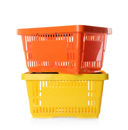 Photo of Color plastic shopping baskets isolated on white