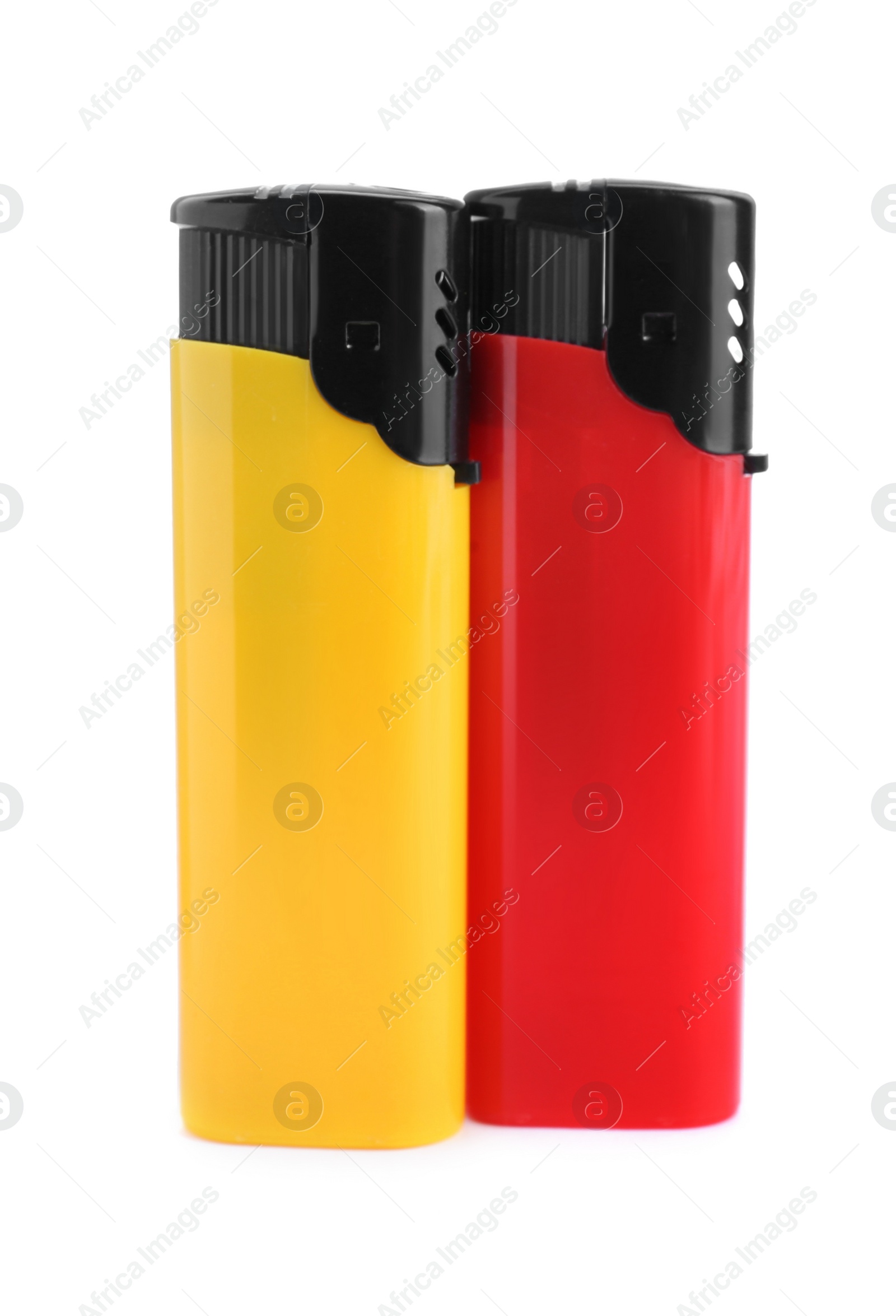 Photo of Stylish small pocket lighters on white background