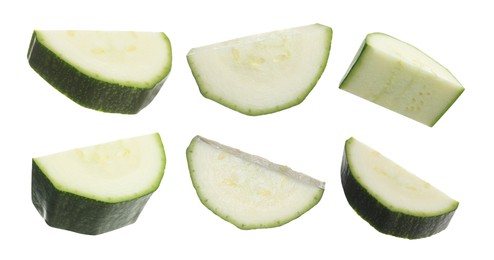 Image of Set with pieces of fresh ripe zucchini on white background