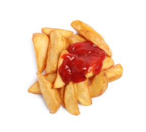 Photo of Delicious baked potato wedges with ketchup on white background, top view