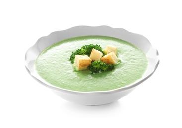 Fresh vegetable detox soup made of broccoli with croutons in dish on white background