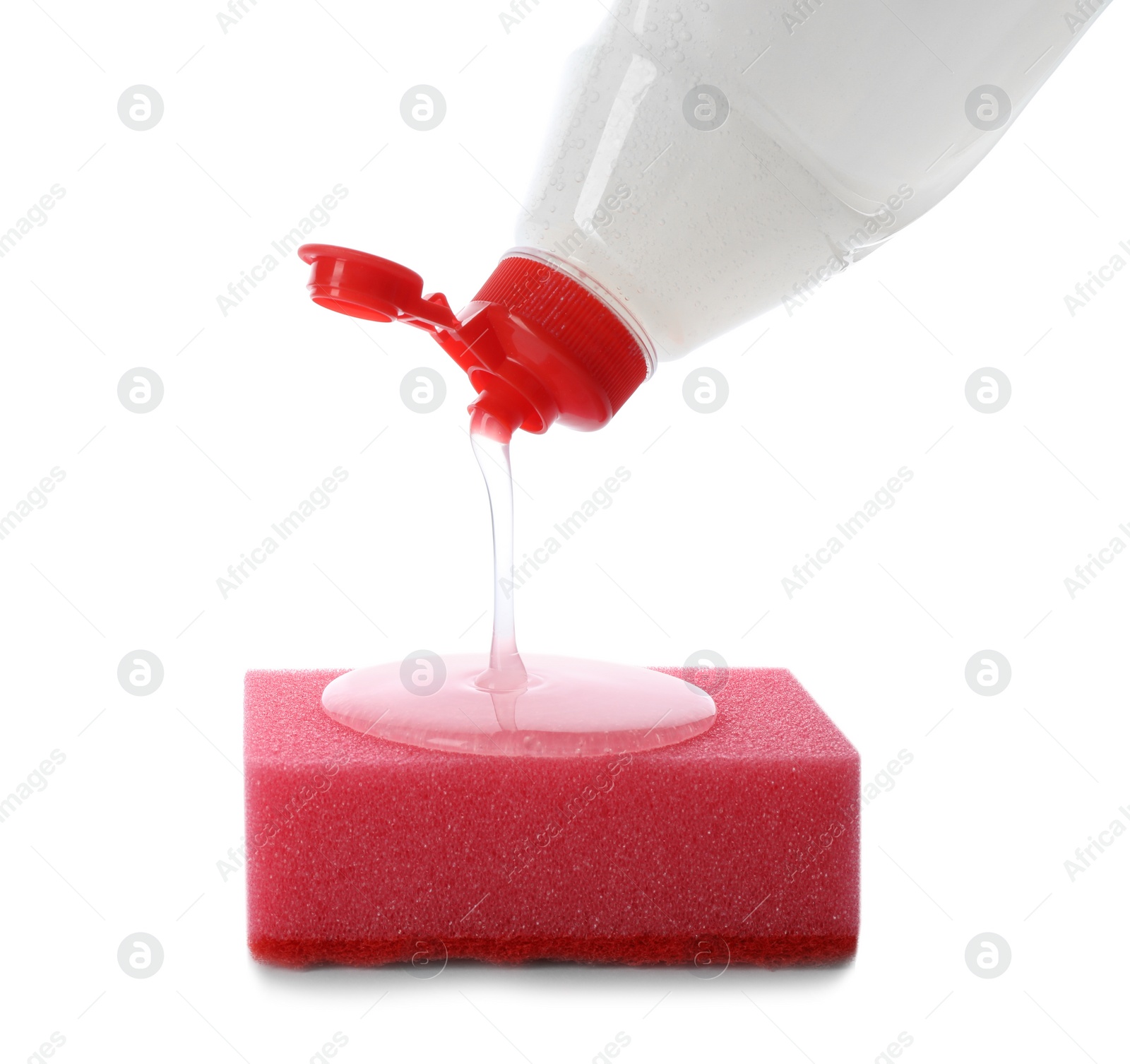 Photo of Pouring cleaning product for dish washing onto sponge on white background