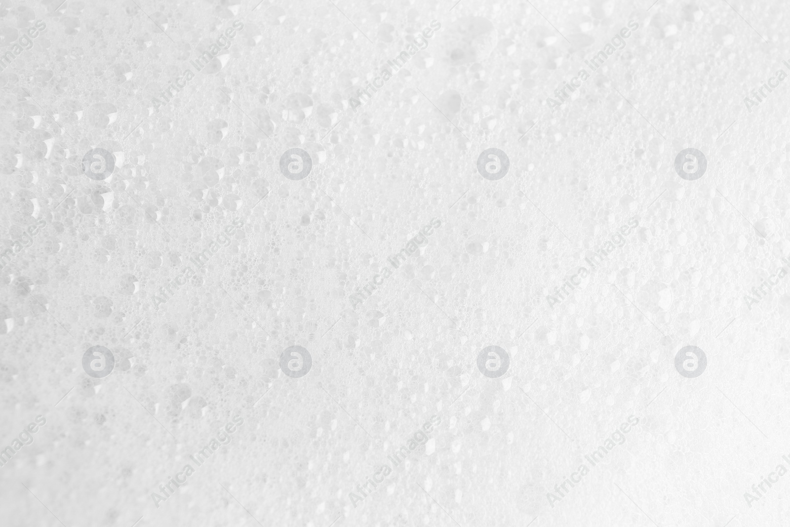 Photo of White fluffy foam as background, top view