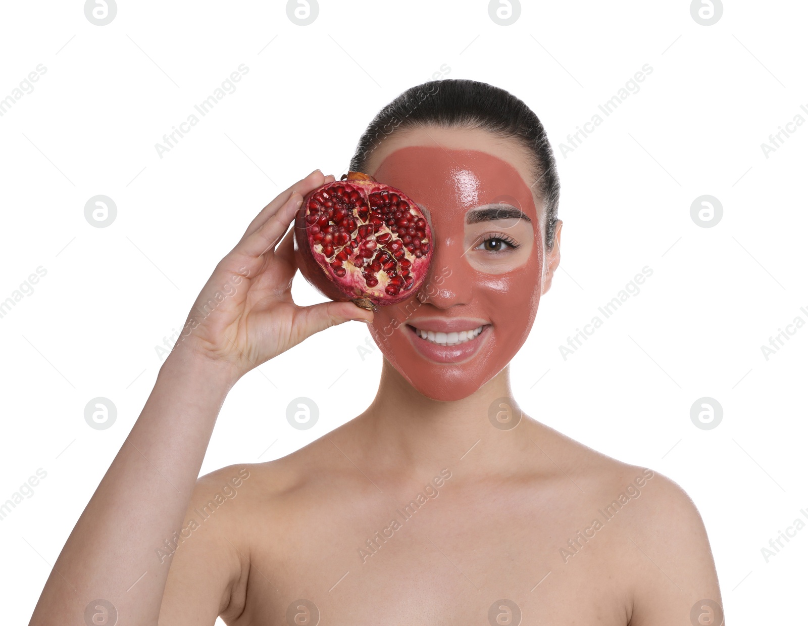 Photo of Woman with pomegranate face mask and fresh fruit on white background