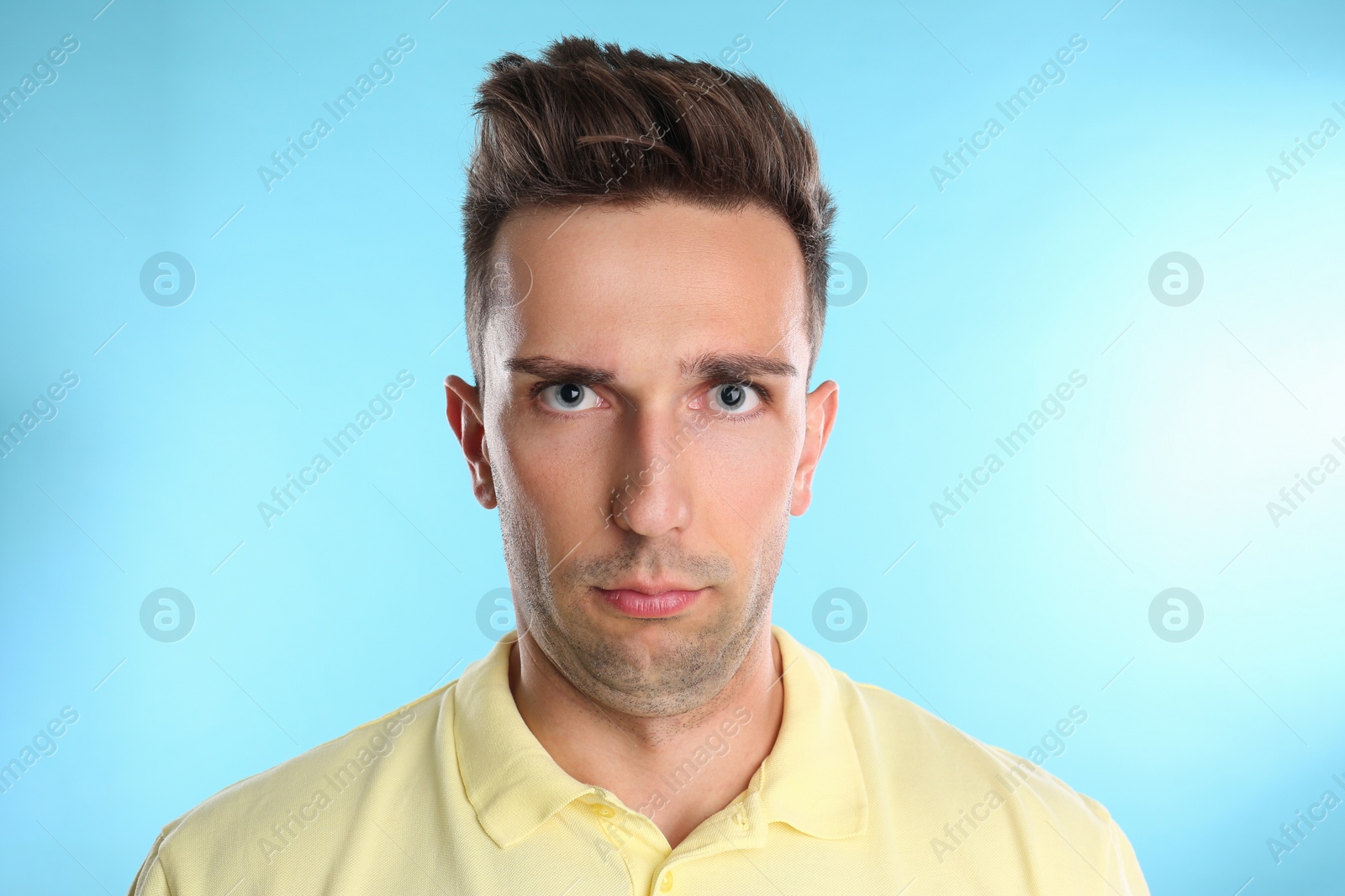 Photo of Young man with double chin on blue background