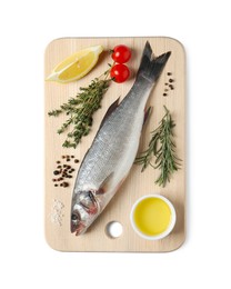 Board with fresh sea bass fish and ingredients on white background, top view