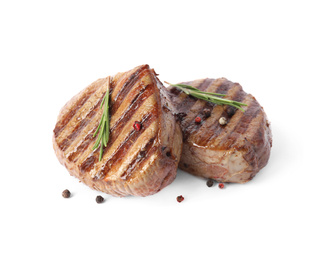 Photo of Delicious grilled beef medallions with rosemary and peppers mix isolated on white