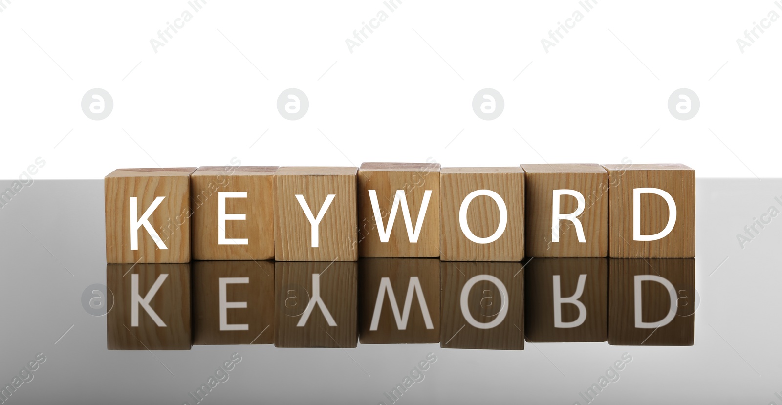 Photo of Word KEYWORD made of wooden cubes on white background