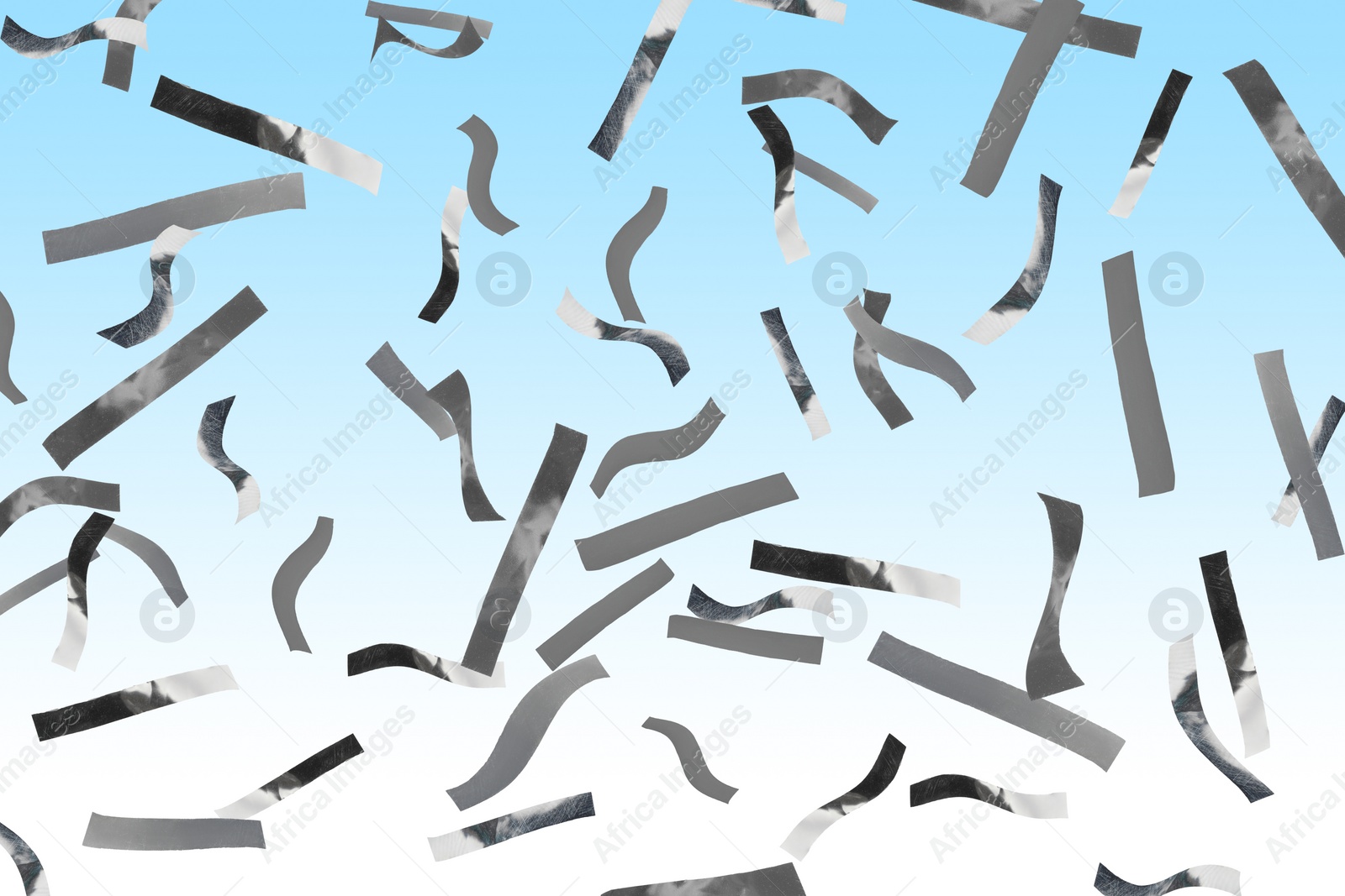 Image of Shiny silver confetti falling on gradient light blue background