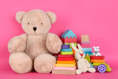 Photo of Set of different toys on pink background