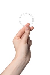 Woman holding diaphragm vaginal contraceptive ring on white background, closeup