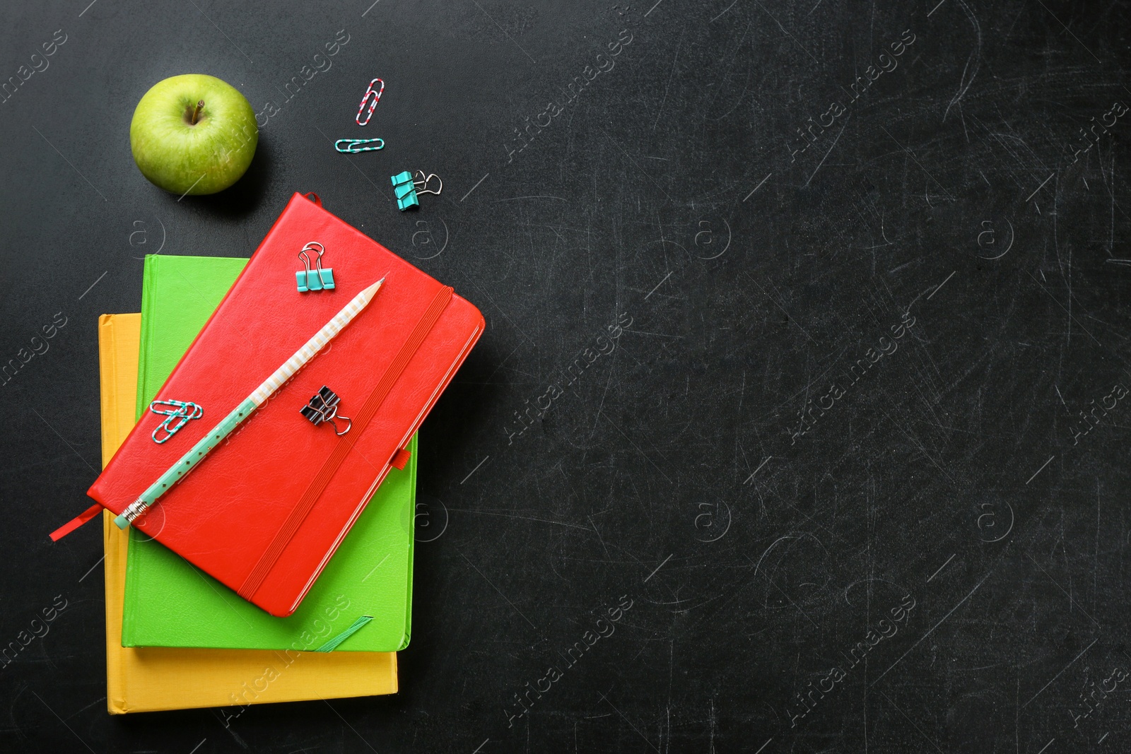 Photo of Flat lay composition for Teacher's day on chalkboard