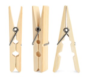 Image of Set with wooden clothespins on white background