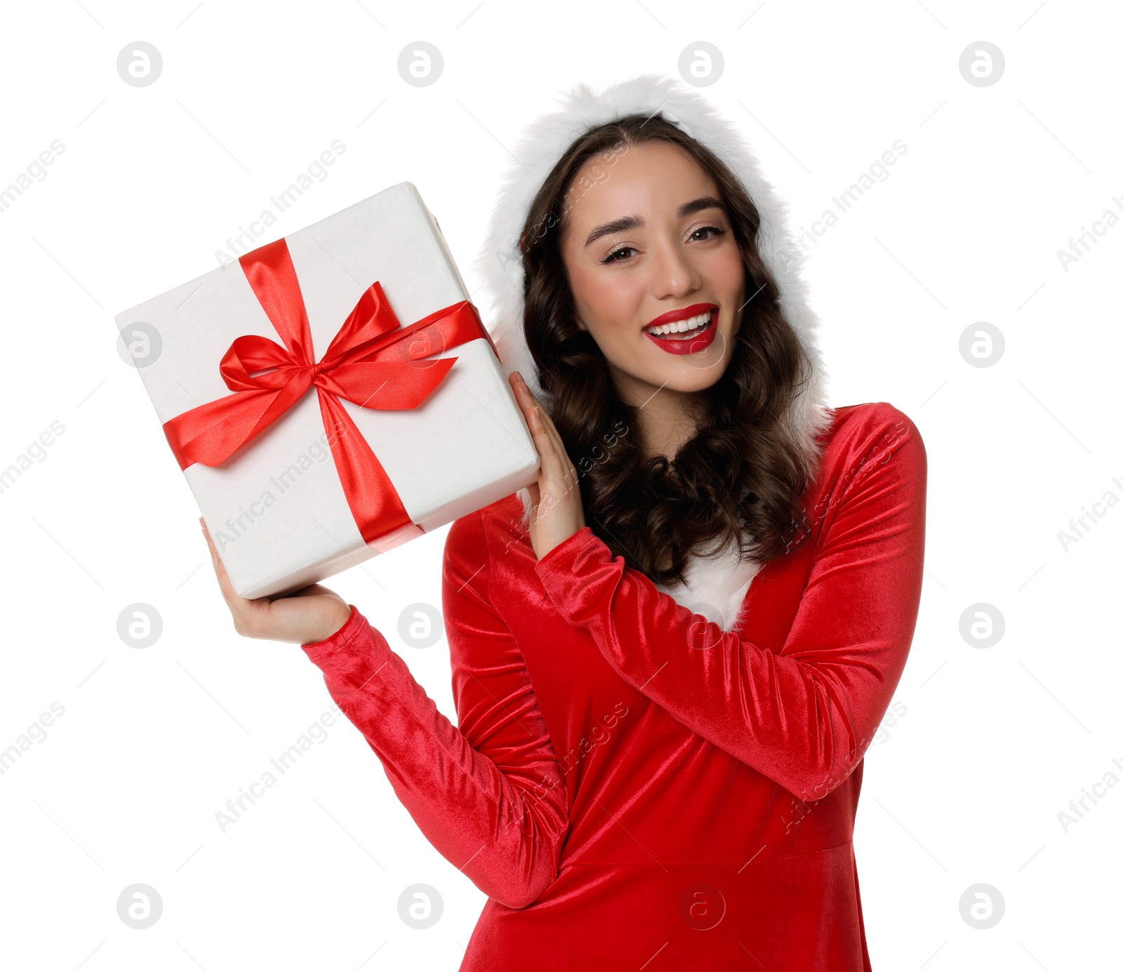 Photo of Beautiful young woman in Christmas red dress holding gift isolated on white