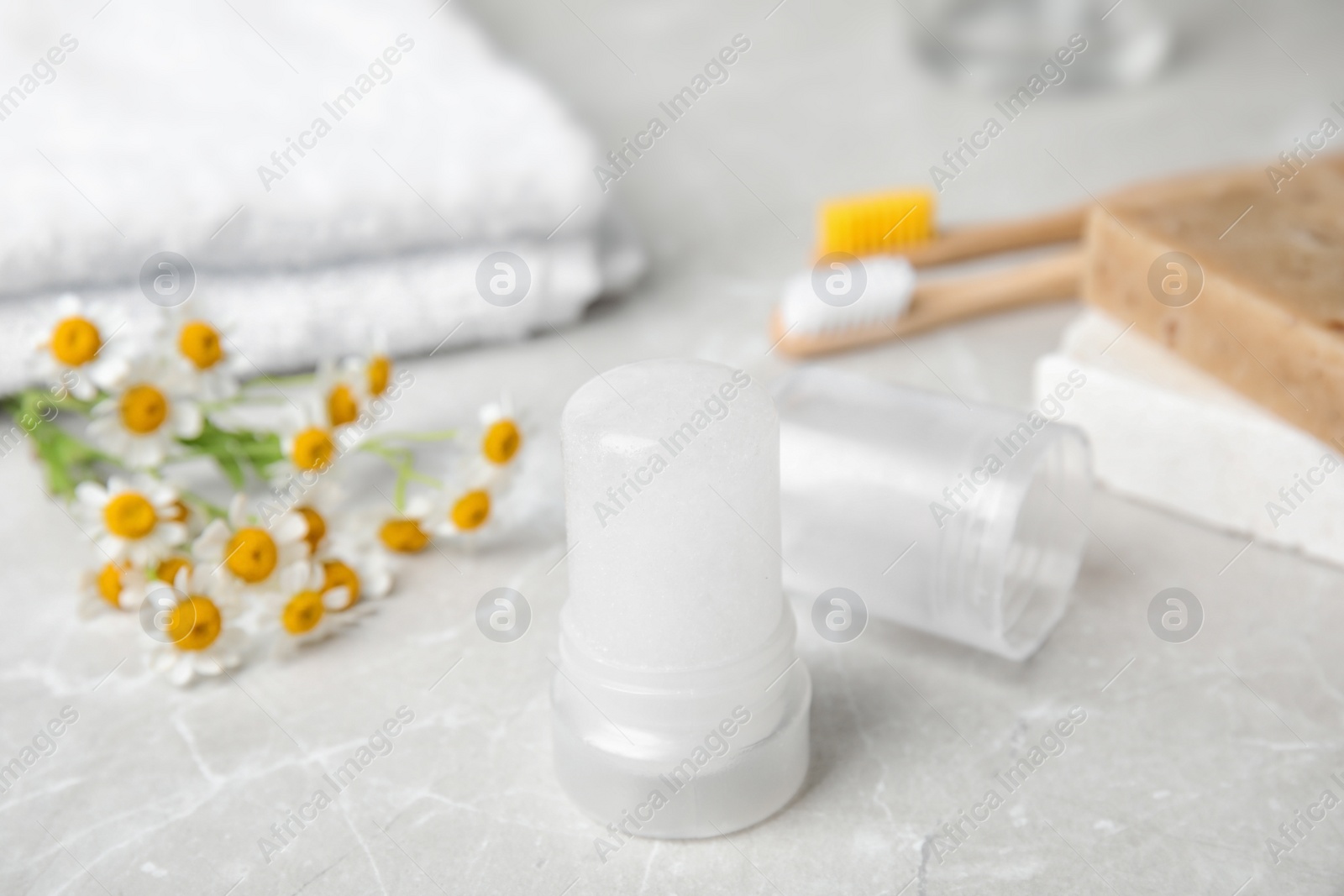 Photo of Natural crystal alum deodorant on light grey marble background