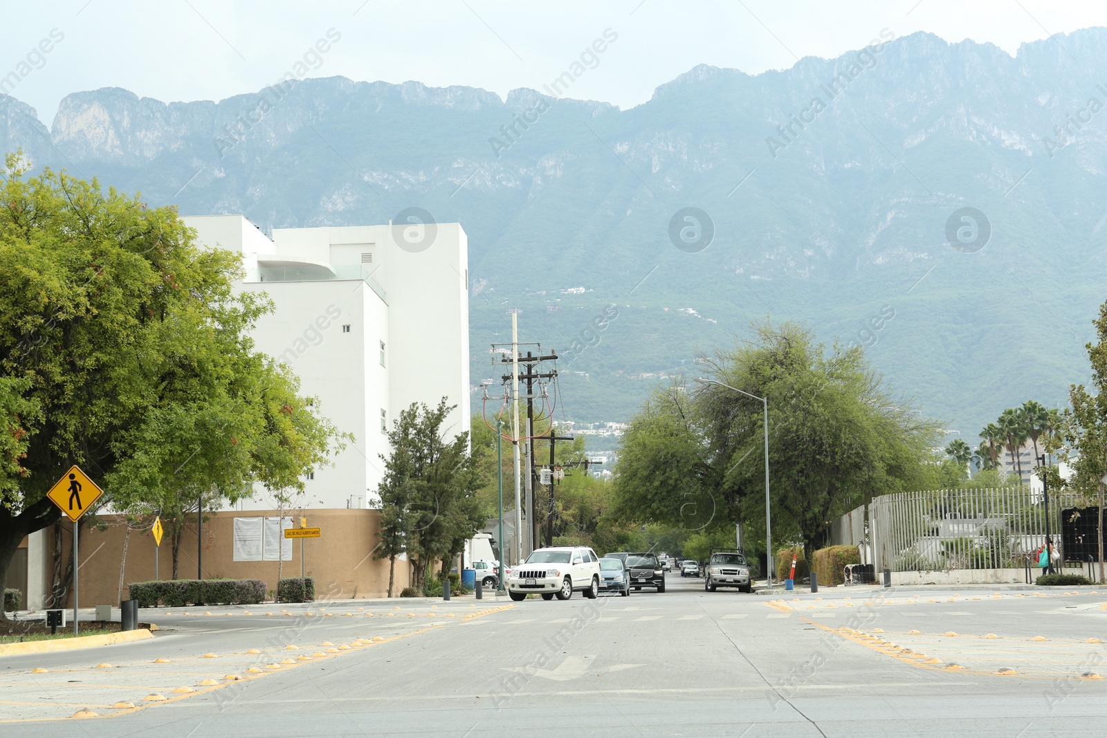 Photo of Mexico, San Pedro Garza Garcia - August 26, 2022: Modern building and cars near beautiful mountains