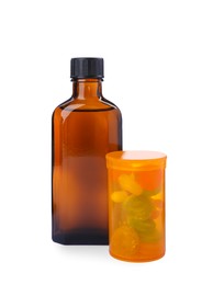 Bottle of syrup with pills on white background. Cough and cold medicine