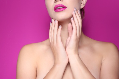 Photo of Beautiful young woman with perfect lips makeup on color background, closeup